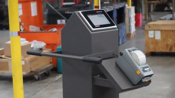 Custom weight scale with touch screen and printer in an industrial setting, designed for tailored weighing solutions