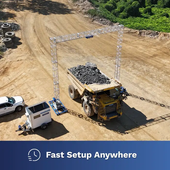 NTEP‑approved WingScan portable gantry scanning a loaded haul truck onsite, illustrating fast setup and reduced need for permanent scales