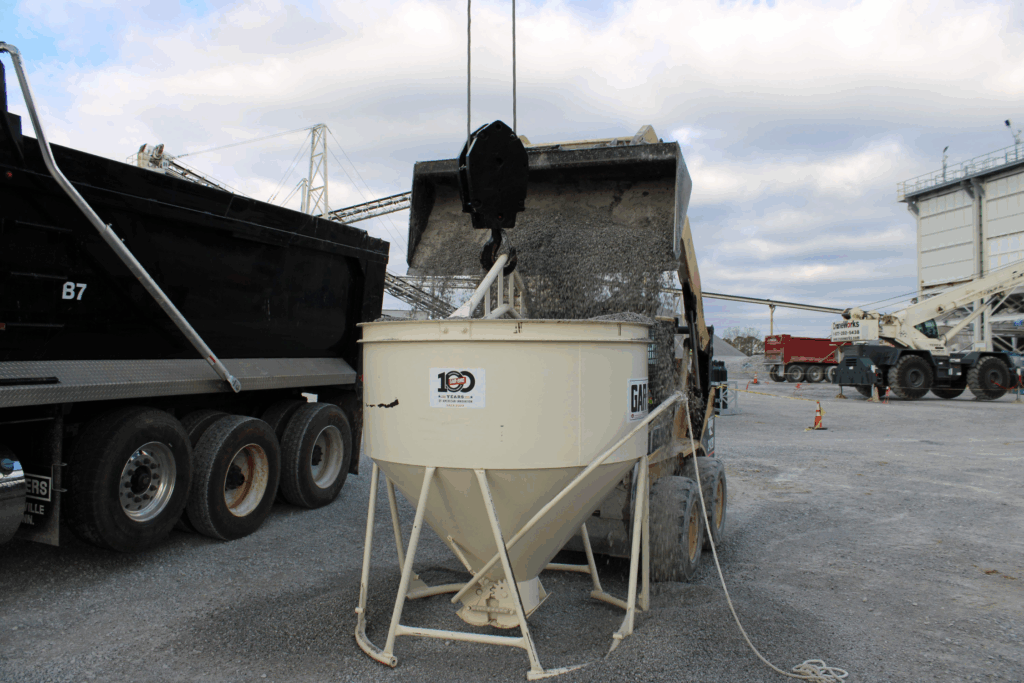 Front-end loader fills a test bucket with aggregate for WingScan-T NTEP field testing