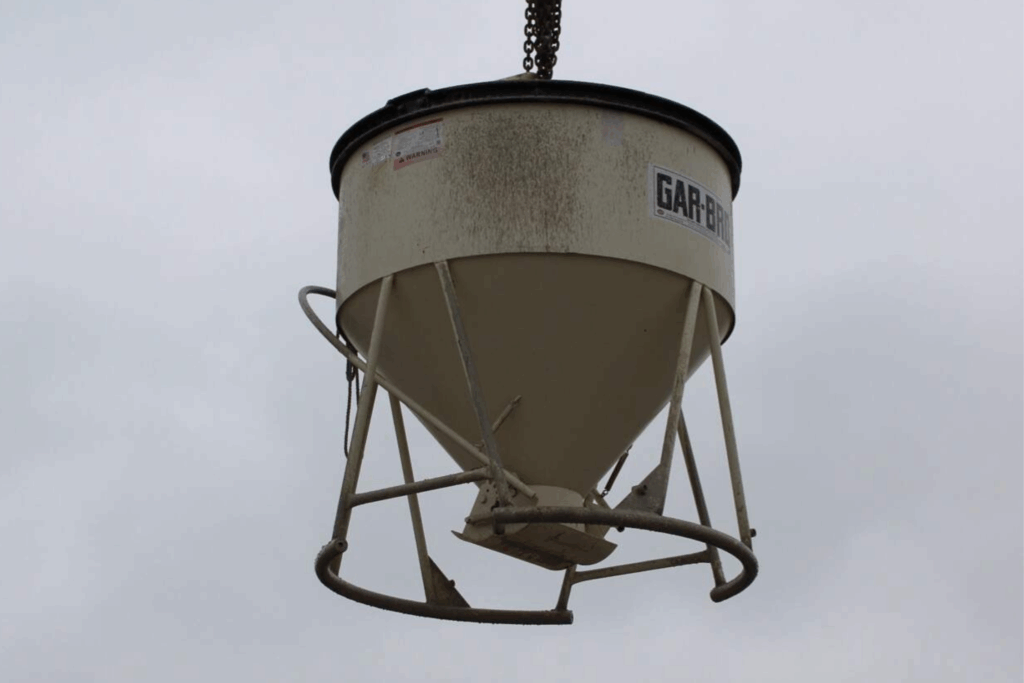 Crane lifts the aggregate-filled test bucket to stage a controlled load for WingScan-T NTEP testing